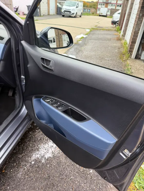 Hyundai i10 with door open showing clean sills and interior after a valet