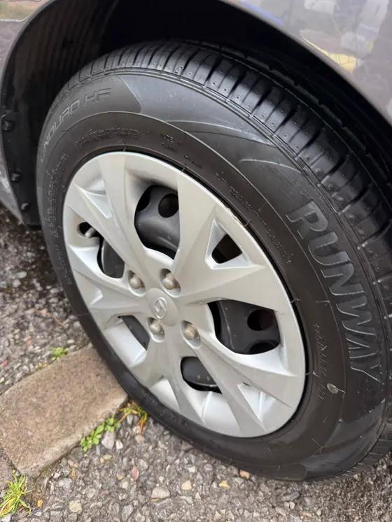 Hyundai i10 alloy wheel and tyre dressed and gleaming after detailing